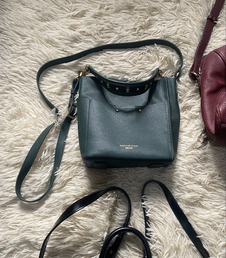 Lancaster, sisley Marja and kurki (Category: Backpacks) located in Manila. Submitted by switchcity (Listing ID 1463245888, Image 3). Description: - Bundle of 4 handbags - Black Lancaster Paris backpack - Deep green crossbody bag with gold studs - Dark red duffel-style bag with long strap - Structured dark green top-handle bag.