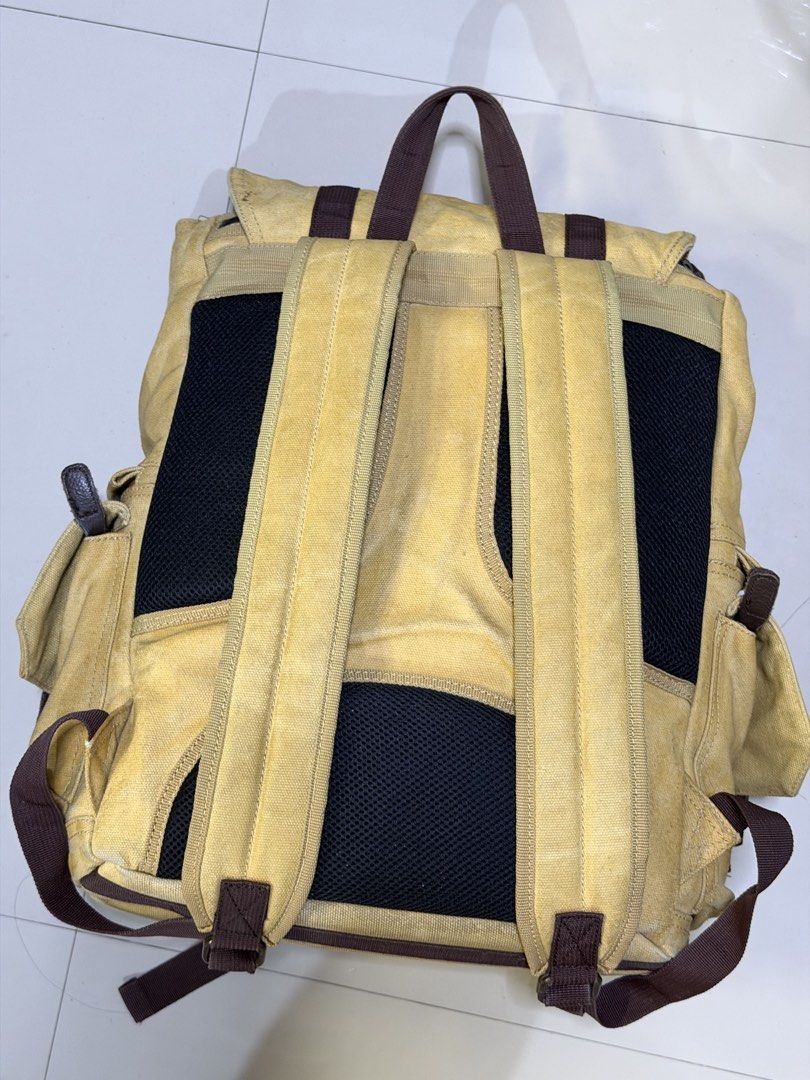 Langly Alpha Camera Bag (Category: Camera Bags & Carriers) located in Las Pinas. Submitted by fjoseiv (Listing ID 1463259462, Image 2). Description: - Khaki canvas backpack with stylish brown leather accents. - Multiple interior compartments, including padded sections for protection. - Two convenient front pockets with secure buckle closures. - Adjustable padded shoulder straps for comfortable carrying. - Versatile: perfect for everyday use or tr
