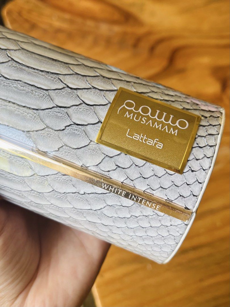 Lattafa Musamam White Intense Eau de Parfum (Category: Fragrance & Deodorants) located in Bacolod City. Submitted by vintage_vogue6100 (Listing ID 1463200067, Image 3). Description: - Lattafa Musamam White Intense EDP - Unique snake-skin inspired bottle design with gold accents - Sophisticated scent suitable for any occasion - Perfect for gifting or personal collection.