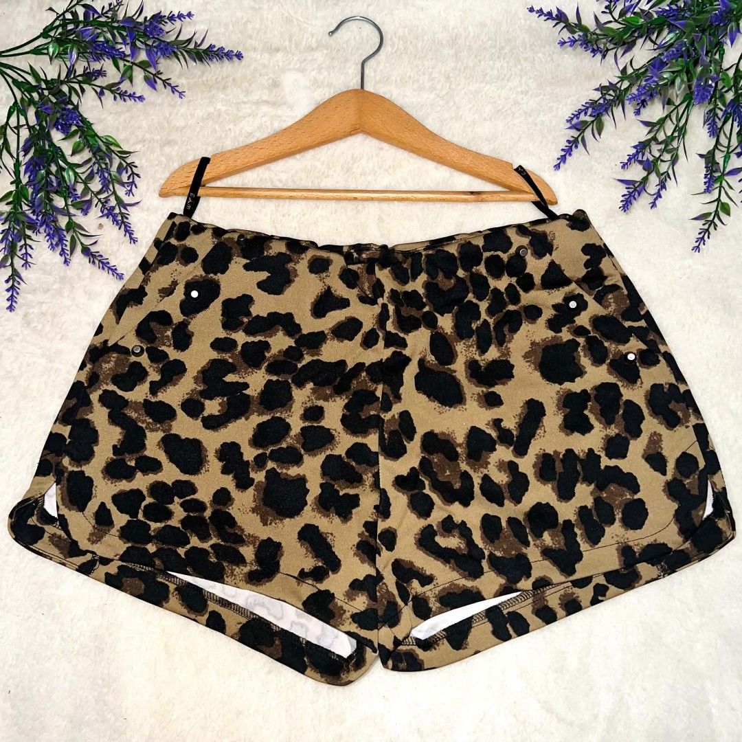 Leopard Print Dolphin Shorts (Category: Shorts) located in Mangaldan. Submitted by ice_thrift_hub (Listing ID 1463313067, Image 1). Description: - Adorable leopard print design - Flattering dolphin hem with white trim - Comfortable elastic waistband - Versatile for lounging or casual wear - Easy to style with any top.