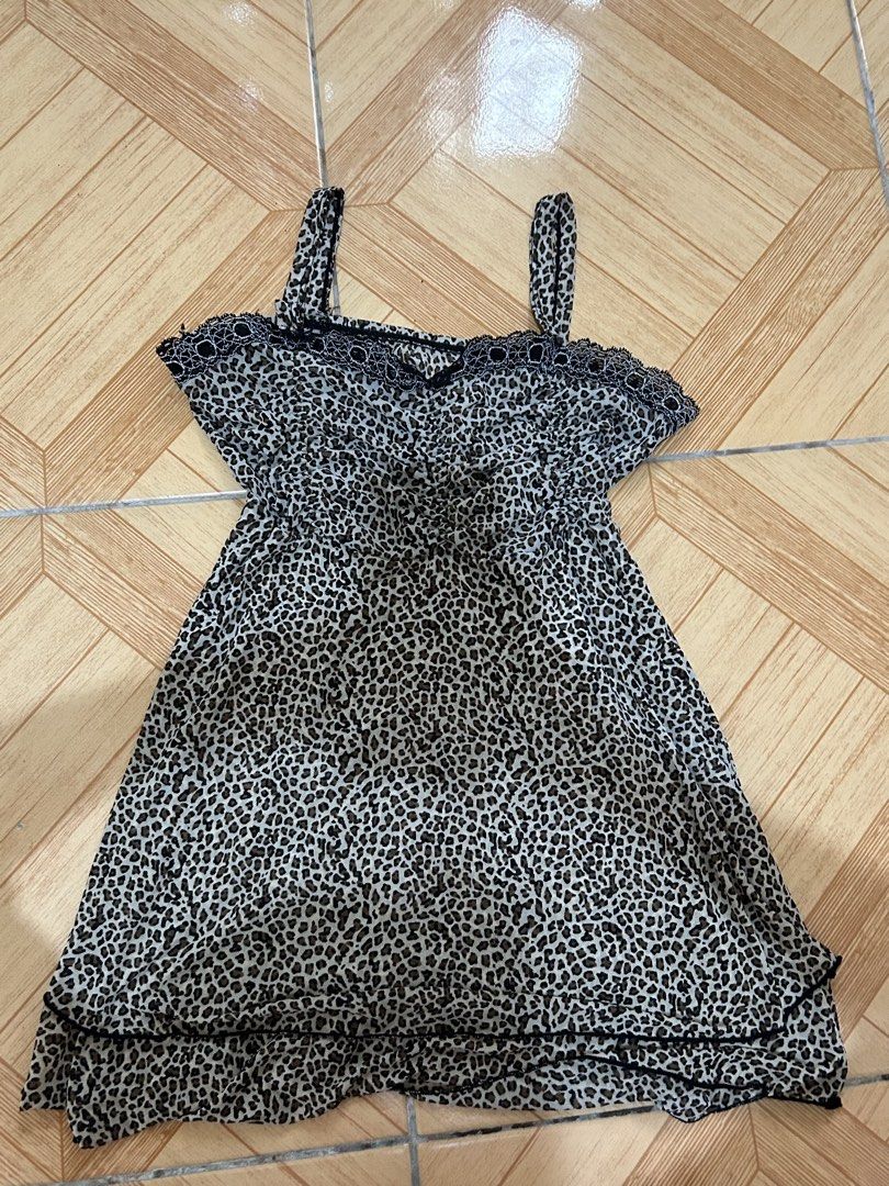 Leopard Print Mini Dress with Lace Trim (Category: Dresses) located in Naga. Submitted by lykkathrift (Listing ID 1463220359, Image 2). Description: - Adorable leopard print mini dress - Features adjustable spaghetti straps - Delicate lace trim along the neckline - Made from lightweight and flowy fabric - Versatile for casual day or chic night out - Easily pairs with sandals or heels.