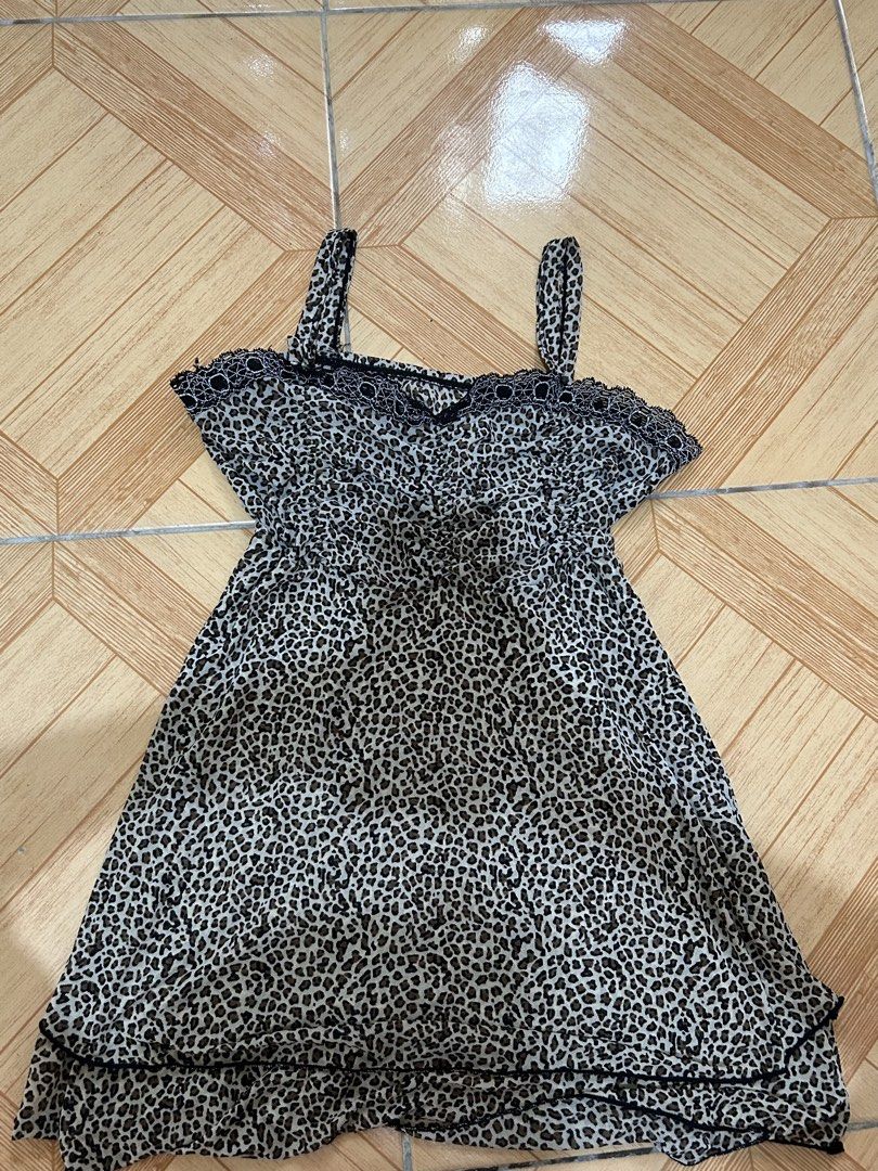Leopard Print Mini Dress with Lace Trim (Category: Dresses) located in Naga. Submitted by lykkathrift (Listing ID 1463220359, Image 1). Description: - Adorable leopard print mini dress - Features adjustable spaghetti straps - Delicate lace trim along the neckline - Made from lightweight and flowy fabric - Versatile for casual day or chic night out - Easily pairs with sandals or heels.