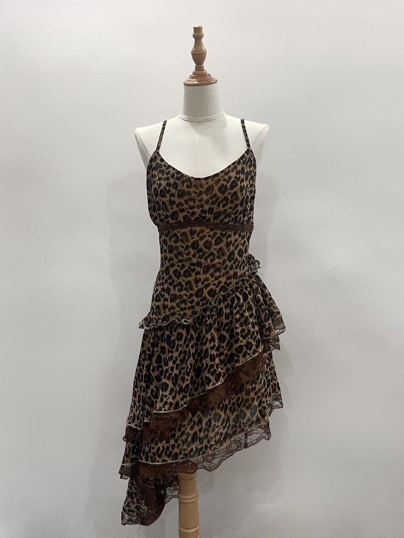 Leopard Print Ruffle Asymmetrical Mini Dress (Category: Dresses) located in Cavite. Submitted by devilourea (Listing ID 1463255652, Image 1). Description: - Cute leopard print mini dress - Spaghetti straps and v-neckline - Ruffled layers with lace trim - Unique asymmetrical hemline - Lightweight and flowy material - Ideal for nights out or parties.