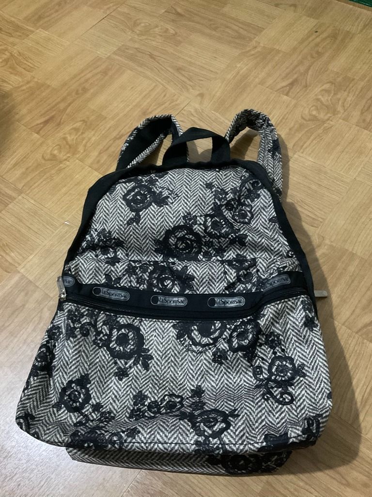 LeSportsac Backpack Floral Print (Category: Backpacks) located in Quezon City. Submitted by frugallove (Listing ID 1463162559, Image 1). Description: - Adorable LeSportsac backpack with a chic black and beige floral print. - Features two convenient zippered compartments on the front for easy access. - Adjustable straps ensure a comfortable fit for all-day wear. - Versatile design, ideal for everyday errands or your next travel adventure. - Approx