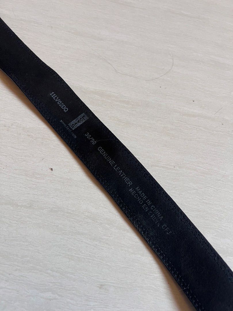 Levi's Genuine Leather Reversible Belt 38/90 (Category: Belts) located in Zamboanga. Submitted by safe.haimer (Listing ID 1463230632, Image 3). Description: - Genuine Levi's leather belt - Reversible design (black on one side) - Features Levi Strauss & Co. logo buckle - Size 32 - Made in China - Note: Shows some wear on the holes and edges, as pictured..
