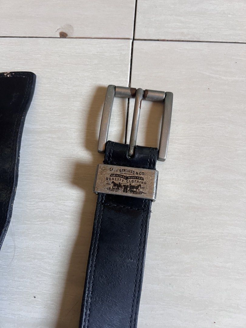 Levi's Genuine Leather Reversible Belt 38/90 (Category: Belts) located in Zamboanga. Submitted by safe.haimer (Listing ID 1463230632, Image 2). Description: - Genuine Levi's leather belt - Reversible design (black on one side) - Features Levi Strauss & Co. logo buckle - Size 32 - Made in China - Note: Shows some wear on the holes and edges, as pictured..