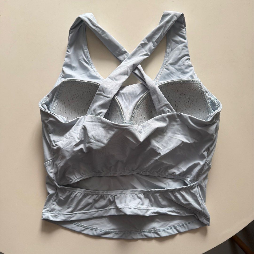 Light Blue Fitted Top (Category: Activewear) located in Manila. Submitted by yasminehannah (Listing ID 1463127629, Image 2). Description: Used 2x only. I like it cos the fabric is nice. Has a style at the back where it is open. Has pads. perfect for workouts..