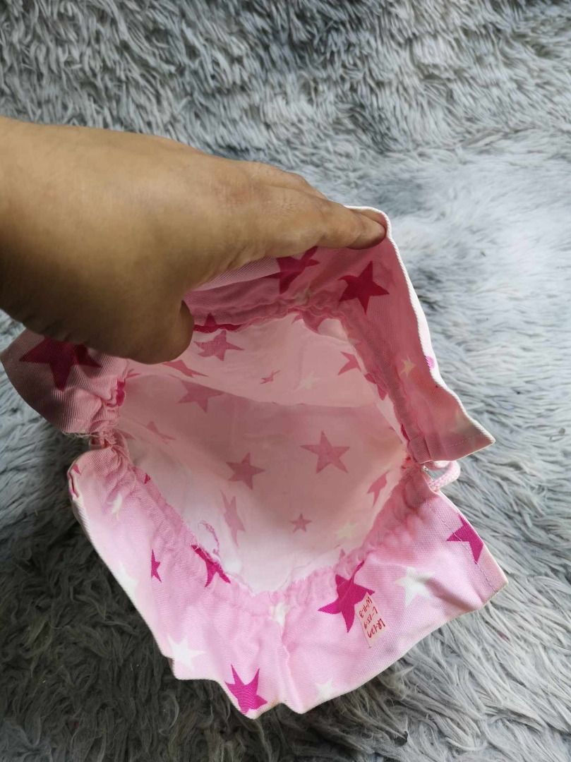 Light Pink Star Printed Design Pouch (Category: Purses & Pouches) located in Santa Cruz. Submitted by jmy_surplus.2 (Listing ID 1463122330, Image 3). Description: Size ; L - 15.4 W - 11.3 Color ; Light Pink Type ; Pouch Brand ; No brand Material ; Nylon Style ; Light pink Drawstring Cosmetic Pouch LR 129 JMY 3 Batch #223.