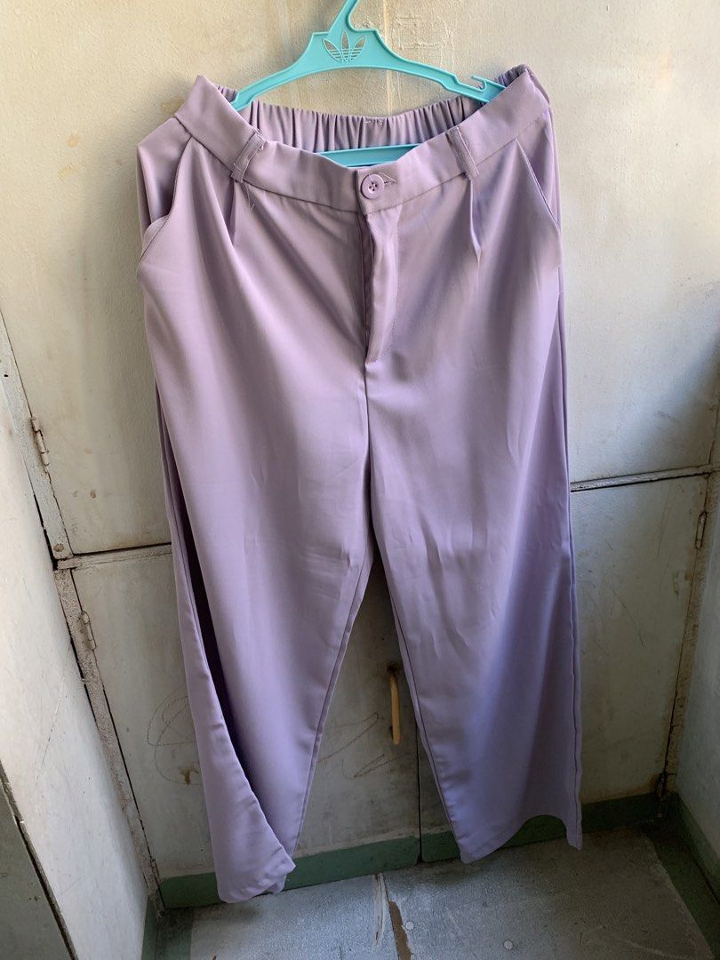 Light Purple Wide Leg Pants (Category: Other Bottoms) located in Manila. Submitted by usagichan_rabbit (Listing ID 1463135552, Image 1). Description: - Light purple wide leg pants - Comfortable elastic waistband at the back - Functional pockets - Fabric with a subtle sheen - Versatile for casual or dressy occasions - Easy to style 27 to 30 waistline.
