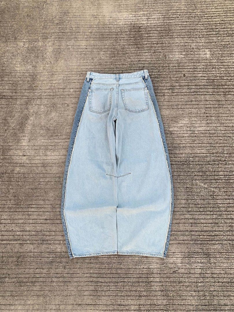 Light Wash Denim Jeans with Contrasting Panels (Category: Jeans) located in Alburquerque. Submitted by jarrenkentnacua (Listing ID 1463266043, Image 2). Description: GU Two Tone Barrel Leg Jeans Size S (62 cm) on tag Waist 28 Length 38 Thigh 13 Leg Opening 9 Issue: Minimal dirts Good Condition.
