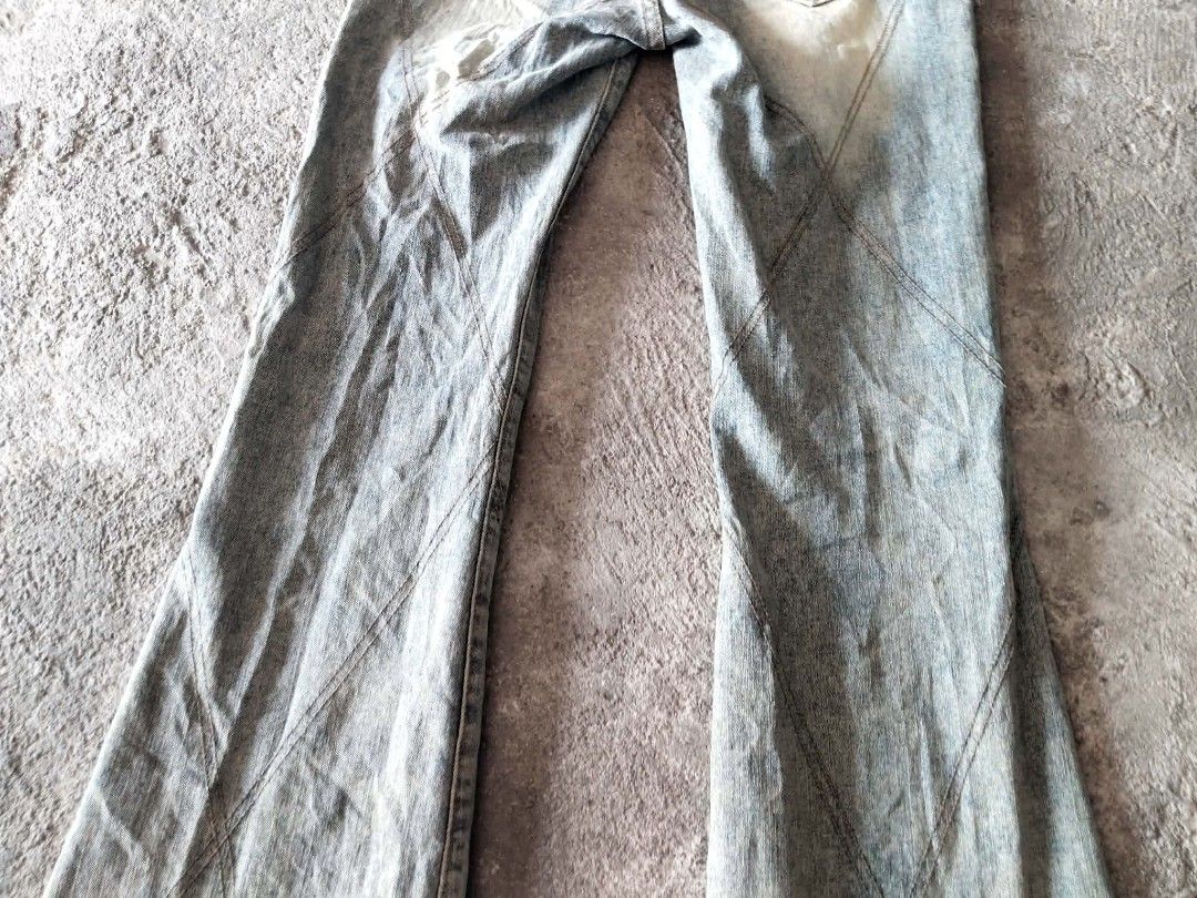 Light Wash Flared Jeans with Unique Stitching (Category: Jeans) located in Manila. Submitted by icamalicdem29 (Listing ID 1463169684, Image 2). Description: - Light wash denim jeans - Flared leg opening - Unique diagonal stitching details (front and back) - Two back pockets - Button and zip closure - Belt loops on waistband - Measurements available in photos.