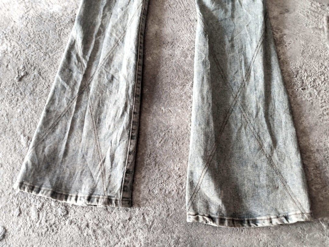 Light Wash Flared Jeans with Unique Stitching (Category: Jeans) located in Manila. Submitted by icamalicdem29 (Listing ID 1463169684, Image 1). Description: - Light wash denim jeans - Flared leg opening - Unique diagonal stitching details (front and back) - Two back pockets - Button and zip closure - Belt loops on waistband - Measurements available in photos.