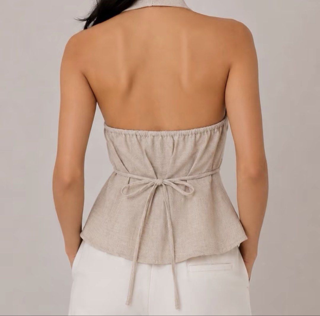 Linen Blend Twisted Front Halter Top (Category: Sleeveless) located in Guinobatan. Submitted by ktonkatsu (Listing ID 1463129265, Image 3). Description: 32”-38” bust never worn, photo from tiktok loc: Bicol shipping thru J&T.