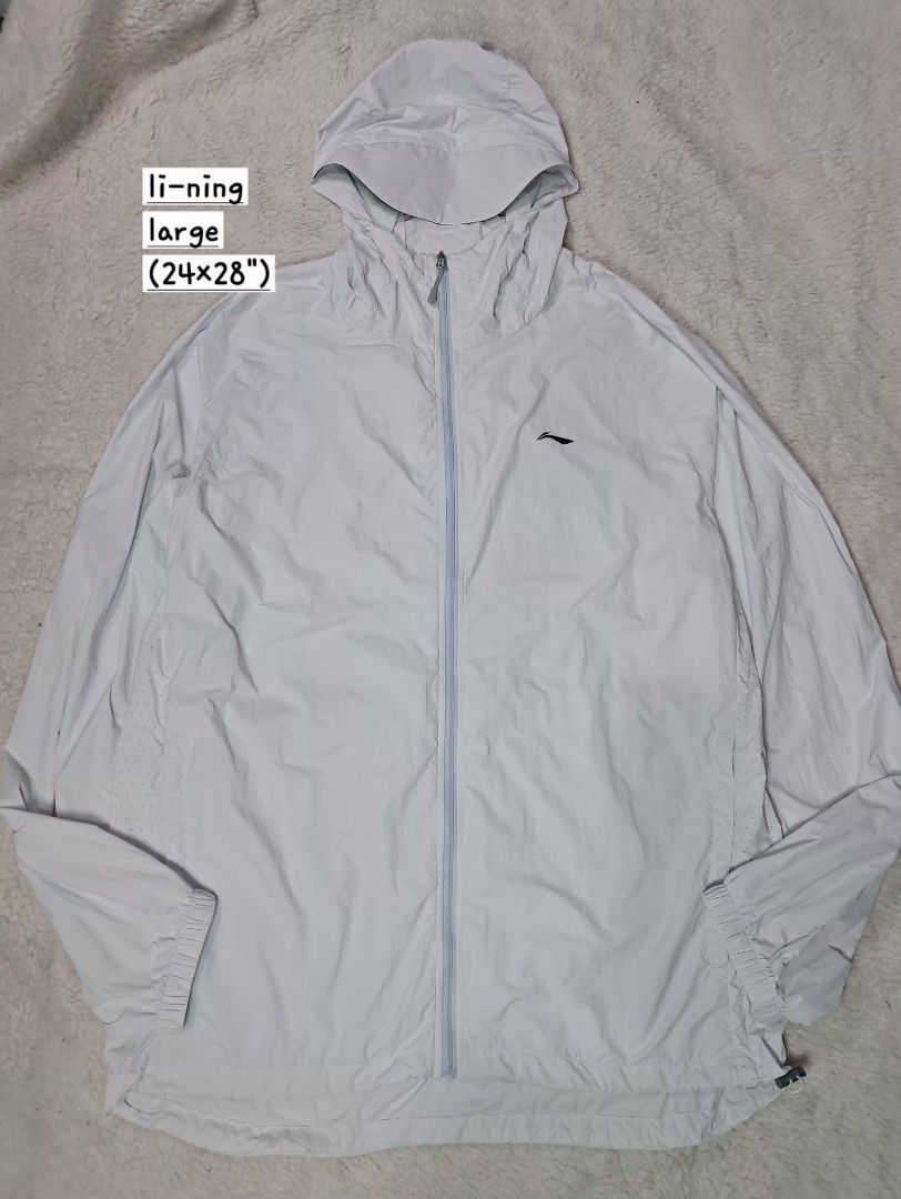 Li-ning unisex windbreaker jacket (Category: Coats, Jackets and Outerwear) located in Baguio. Submitted by mishmashfritz (Listing ID 1463202275, Image 2). Description: Like new, no flaws, light blue, breathable lightweight material, mesh side part, extended hood, adjustable hem, reflective strip sa back.