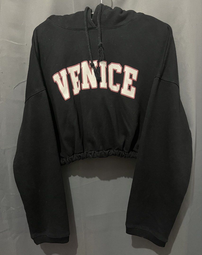 LiuLiu+ Black Venice Cropped Hoodie (Category: Coats, Jackets and Outerwear) located in Baguio. Submitted by maplee_syrupp (Listing ID 1463207021, Image 1). Description: Venice graphic cropped hoodie Elasticated hem for a snug fit Brand: LiuLiu+ Designed by: Jong Size XS-S.