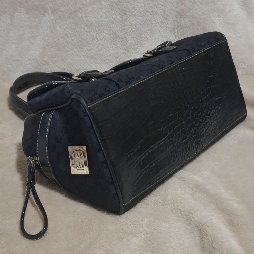 Liz Claiborne Black Handbag (Category: Shoulder Bags) located in Quezon City. Submitted by MP_Declutters (Listing ID 1463218331, Image 3). Description: Liz Claiborne Black Handbag 👜 Pre-owned Liz Claiborne structured handbag with elegant patterned fabric and glossy crocodile-effect trim. Comes with top handles and shoulder strap. Spacious interior with zip pocket. 📏 Size: 29 × 18 × 14 cm ✨ Condition: Pre-owned, good condition with signs of age/