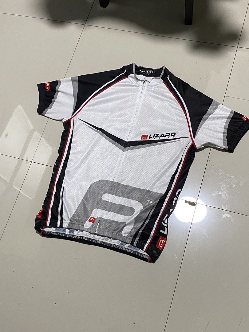 Lizard Short Sleeve Cycling Jersey XL (Category: Activewear) located in Baguio. Submitted by yunothewizardking (Listing ID 1463230760, Image 1). Description: - Lizard cycling jersey - Short sleeves - Full zip front - Color: White with black, grey, and red accents - Large 'R' graphic on the front - 'Ride Assist' text on the back - Zippered pocket on the back for essentials - Perfect for your cycling adventures.