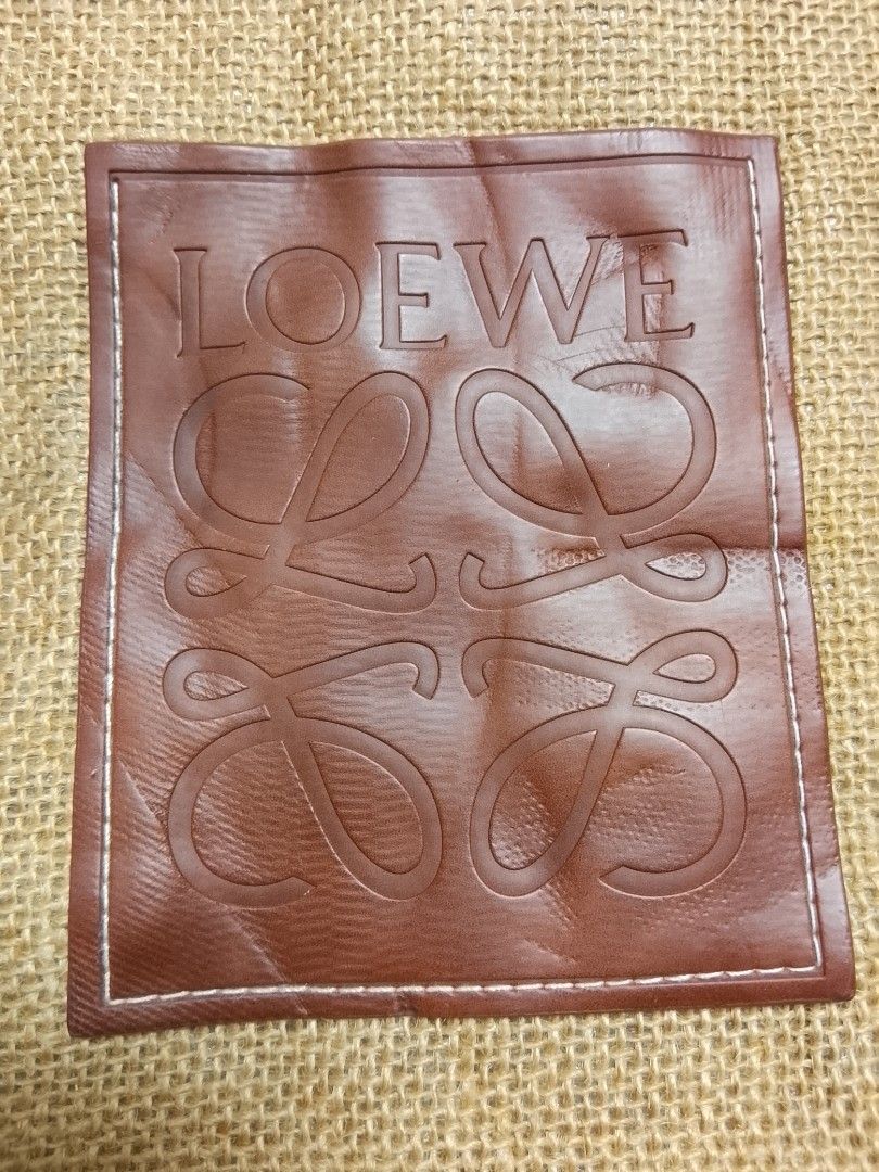 Loewe Jute Tote Bag (Category: Luxury Bags & Wallets) located in Talisay. Submitted by southernthrifts (Listing ID 1463136866, Image 2). Description: - Authentic Loewe Anagram tote bag - Material: Jute - Color: Natural beige - Features iconic Loewe anagram logo on leather patch - White handles - Ideal for everyday use or as a beach bag - Made in Spain.