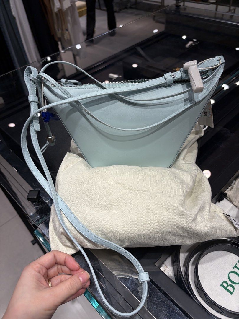 Loewe Mini Hammok Tote Bag Light Blue Leather (Category: Luxury Bags & Wallets) located in Cavite. Submitted by tripleKgels (Listing ID 1463174081, Image 1). Description: - Brand: Loewe - Model: Hammok Mini Bag - Color: Light Blue - Material: Soft Leather - Closure: Zip - Strap: Long strap for crossbody or shoulder wear - Includes: Dust bag and carfs - Ideal for: Everyday use.