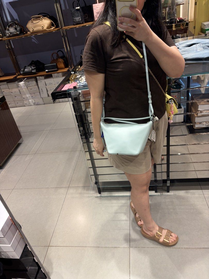 Loewe Mini Hammok Tote Bag Light Blue Leather (Category: Luxury Bags & Wallets) located in Cavite. Submitted by tripleKgels (Listing ID 1463174081, Image 3). Description: - Brand: Loewe - Model: Hammok Mini Bag - Color: Light Blue - Material: Soft Leather - Closure: Zip - Strap: Long strap for crossbody or shoulder wear - Includes: Dust bag and carfs - Ideal for: Everyday use.