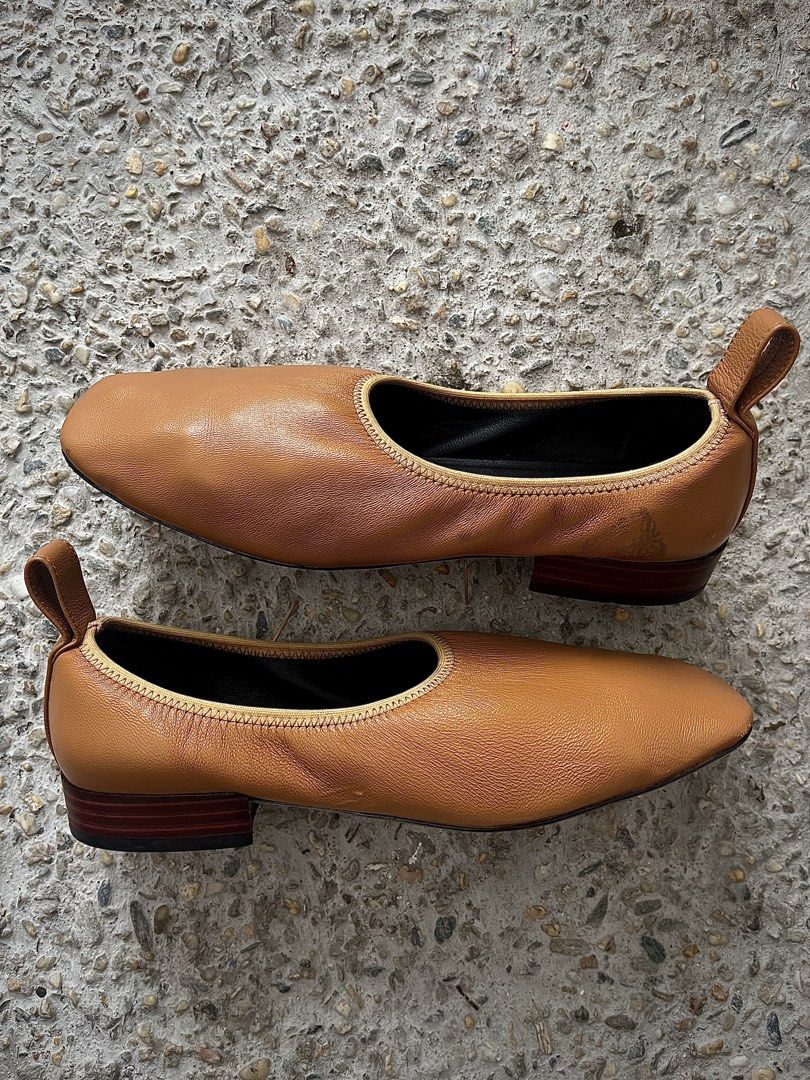 Loewe Tan Soft Ballerina Pumps (Category: Sneakers & Footwear) located in Dasmarinas. Submitted by bandananowheree (Listing ID 1463169339, Image 3). Description: Grained lambskin ballerina flats in tan. Square toe. Tonal grosgrain trim at collar. Leather pull-loop at heel collar. 25mm Stacked leather sole in brown. There is some visible staining/color transfer from another shoe, and the pair could use a little color restoration to bring it back t