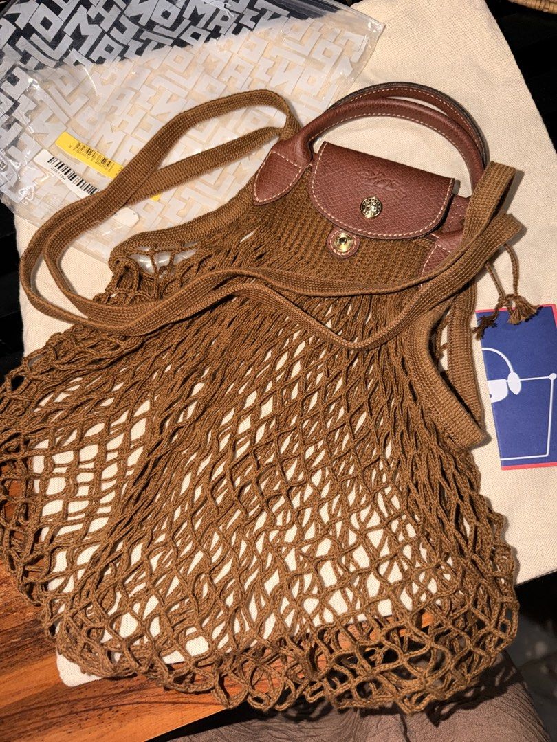 Longchamp Le Pliage Filet Tote Bag Brown (Category: Luxury Bags & Wallets) located in Las Pinas. Submitted by twiceloved24 (Listing ID 1463263182, Image 1). Description: Bought for almost ₱9,000 Used once only - will pass as brand new! with tags + ziplock Selling for ₱7,000.