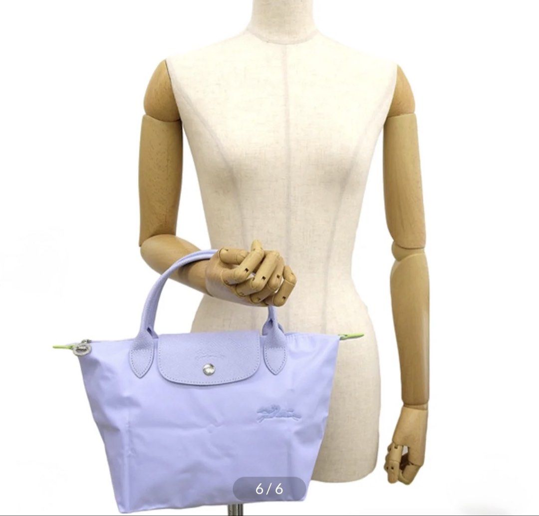 Longchamp Le Pliage Top Handle Bag XS (Category: Luxury Bags & Wallets) located in Manila. Submitted by bl0ss0ms711 (Listing ID 1463299916, Image 2). Description: - Purchased in Switzerland - Comes with extra strap (not Longchamp) as this is only a short handle version - Very rare color usually available only in Europe and in Retail store. - It’s close to Periwinkle or Light Blue. Very subtle blue/lilac - Lightweight and foldable nylon bag - Styl