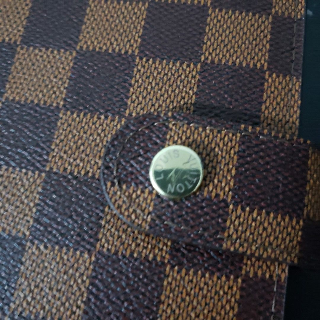 LV Damier Ebene Agenda size MM (Category: Luxury Bags & Wallets) located in Manila. Submitted by poshcara (Listing ID 1463227929, Image 2). Description: Louis Vuitton Agenda Cover - Classic Damier Ebene Canvas - Secure Snap Button Closure - Interior Card Slots - Convenient Pen Loop - Includes Address Book Insert - Ideal for Daily Scheduling & Contact Organization.
