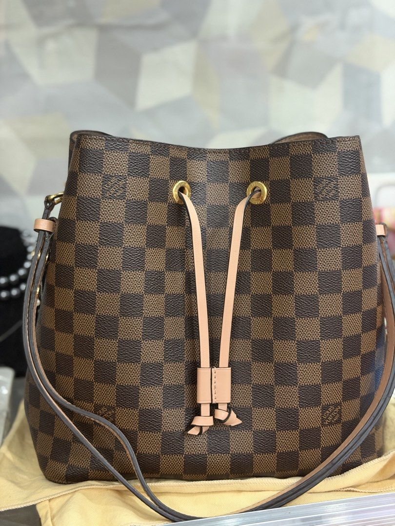 Louis Vuitton Damier Ebene Neverfull GM Bucket Bag (Category: Luxury Bags & Wallets) located in Pasig City. Submitted by tamara0520 (Listing ID 1463259764, Image 1). Description: - Classic Louis Vuitton bucket bag - Damier Ebene canvas - Secure drawstring closure - Adjustable leather straps - Spacious interior - Elegant gold-tone hardware - Timeless and versatile for everyday wear - Microchip.