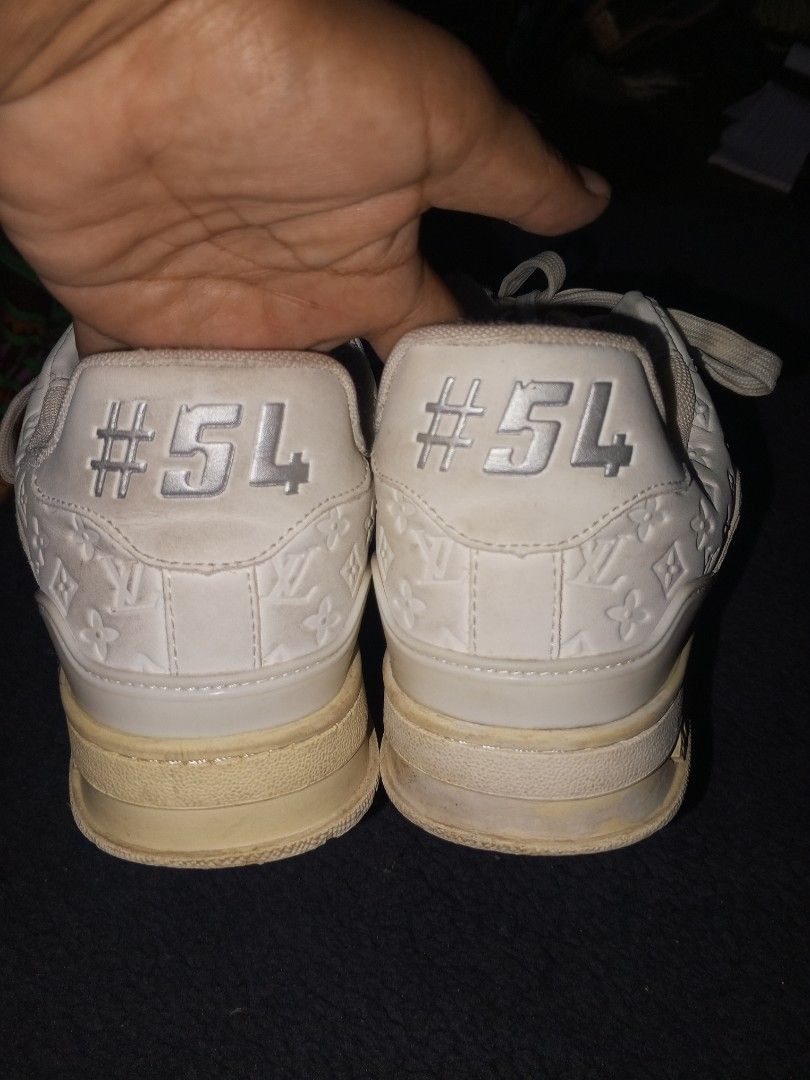 Louis Vuitton LV Trainer Sneakers White Monogram (Category: Sneakers & Footwear) located in Magalang. Submitted by zeiansoria64090 (Listing ID 1463217608, Image 3). Description: - Louis Vuitton LV Trainer sneakers - Color: White with Grey Monogram pattern - Size: 7 UK / 40 EUR / 250 CM - Made in Vietnam - Perfect for adding a touch of luxury to your streetwear.
