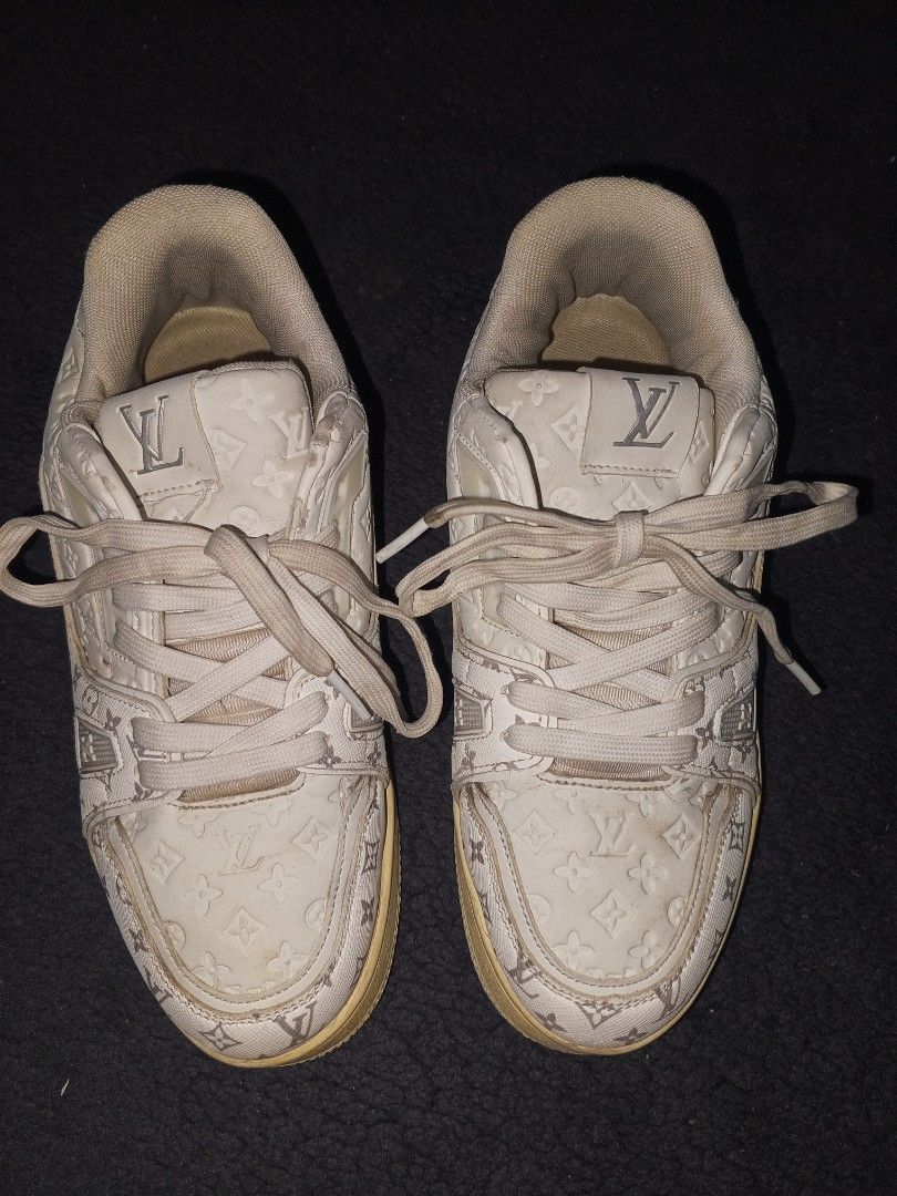 Louis Vuitton LV Trainer Sneakers White Monogram (Category: Sneakers & Footwear) located in Magalang. Submitted by zeiansoria64090 (Listing ID 1463217608, Image 2). Description: - Louis Vuitton LV Trainer sneakers - Color: White with Grey Monogram pattern - Size: 7 UK / 40 EUR / 250 CM - Made in Vietnam - Perfect for adding a touch of luxury to your streetwear.