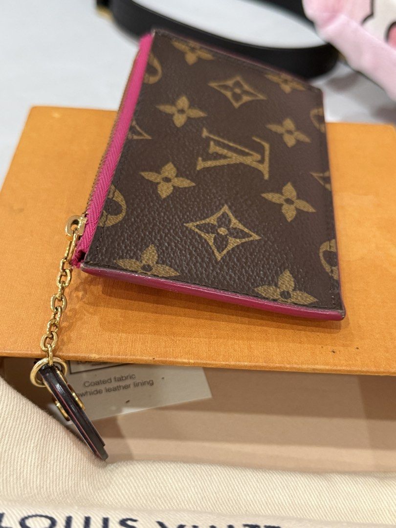 Louis Vuitton Monogram Canvas Card Holder Pink Trim (Category: Luxury Bags & Wallets) located in Quezon City. Submitted by closet24 (Listing ID 1463189865, Image 2). Description: - Authentic Louis Vuitton card holder - Classic monogram canvas with vibrant pink trim and interior - Adorable flower charm included - Secure zipper closure - Comes with original box and dust bag -signs of use on corners see photos Hardware excellent condition Slightly n
