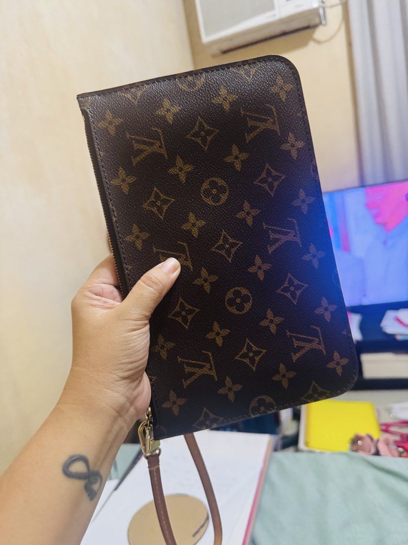 Louis Vuitton Monogram Pouch with Wrist Strap (Category: Luxury Bags & Wallets) located in Marilao. Submitted by cj458678 (Listing ID 1463251441, Image 2). Description: - Authentic Louis Vuitton monogram pouch - Classic brown and gold pattern - Detachable leather wrist strap included - Secure zipper closure - Ideal for organizing essentials or carrying solo.
