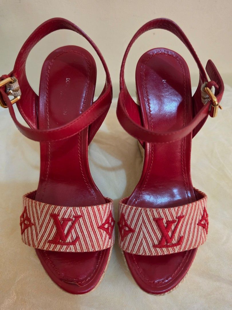 Louis Vuitton Sail Away wedge espadrille sandals (Category: Sneakers & Footwear) located in Cavite. Submitted by kazi_preloved (Listing ID 1463119829, Image 2). Description: - Authentic Louis Vuitton red leather espadrille wedges - Features iconic LV monogram on fabric strap - Secure buckle ankle strap closure - Classic espadrille sole - Made in Italy - insole edge to edge size is 22cm - wedge height is 4.5cm.