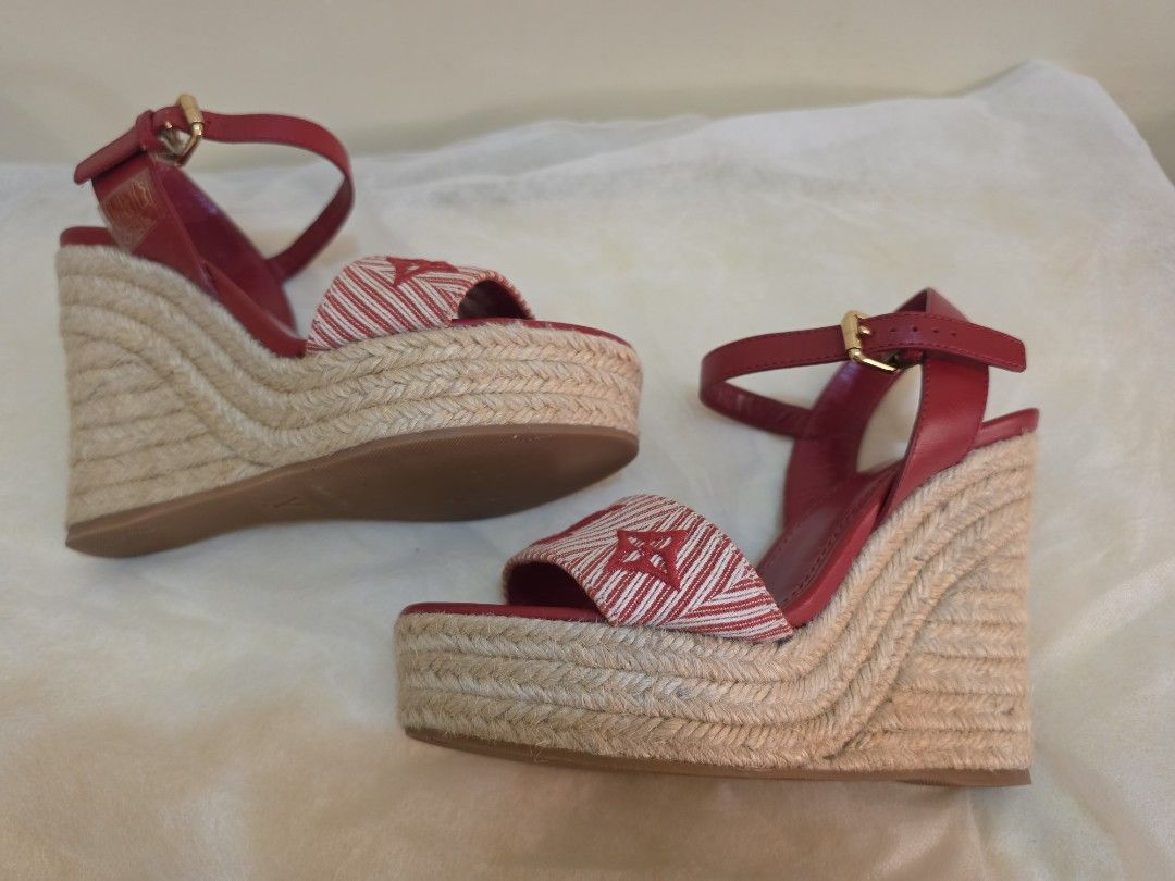 Louis Vuitton Sail Away wedge espadrille sandals (Category: Sneakers & Footwear) located in Cavite. Submitted by kazi_preloved (Listing ID 1463119829, Image 3). Description: - Authentic Louis Vuitton red leather espadrille wedges - Features iconic LV monogram on fabric strap - Secure buckle ankle strap closure - Classic espadrille sole - Made in Italy - insole edge to edge size is 22cm - wedge height is 4.5cm.