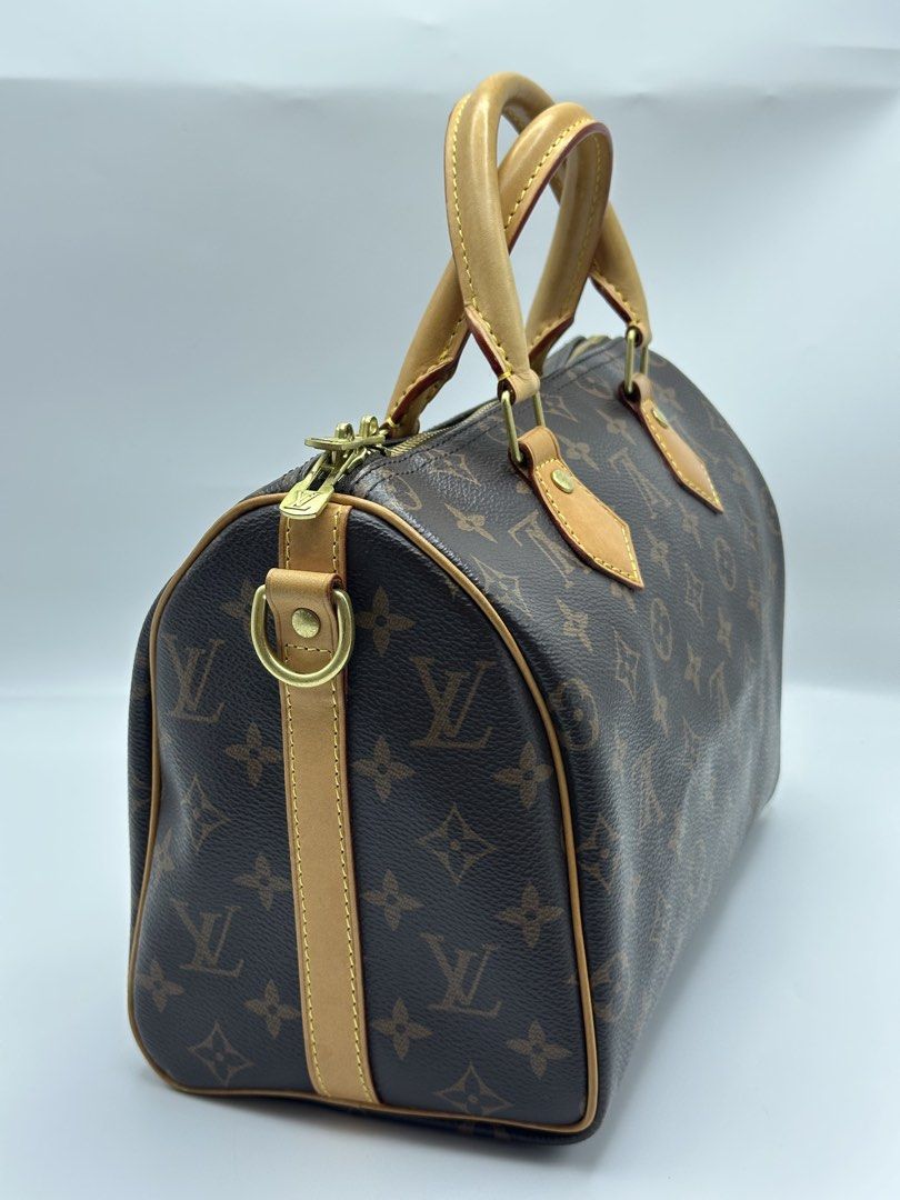 Louis Vuitton Speedy Monogram Canvas Handbag (Category: Luxury Bags & Wallets) located in Manila. Submitted by dough_lux (Listing ID 1463162685, Image 2). Description: - Classic Louis Vuitton Speedy bag - Monogram canvas with vachetta leather trim and handles - Gold-tone hardware with iconic LV zipper pull and padlock - Timeless and versatile piece - Ideal for everyday use or travel - Approximately 30cm in size.