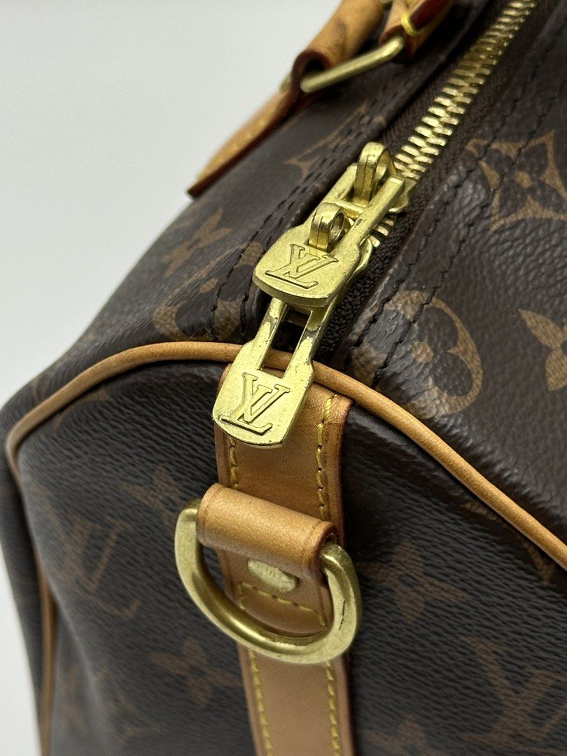 Louis Vuitton Speedy Monogram Canvas Handbag (Category: Luxury Bags & Wallets) located in Manila. Submitted by dough_lux (Listing ID 1463162685, Image 3). Description: - Classic Louis Vuitton Speedy bag - Monogram canvas with vachetta leather trim and handles - Gold-tone hardware with iconic LV zipper pull and padlock - Timeless and versatile piece - Ideal for everyday use or travel - Approximately 30cm in size.