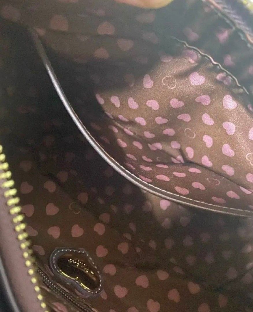 Lovcat Paris Shoulder Bag - Metallic Purple (Category: Shoulder Bags) located in Cavite. Submitted by mahthriftshop (Listing ID 1463159942, Image 3). Description: - Cute Lovcat Paris shoulder bag - Metallic purple color with suede-like panel - Zipper closure - Fun heart print interior lining - Small heart charm attached - Great for everyday use.