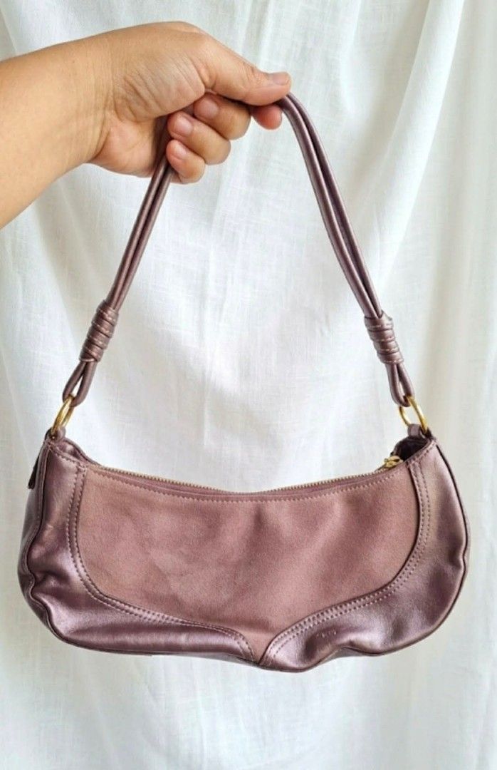 Lovcat Paris Shoulder Bag - Metallic Purple (Category: Shoulder Bags) located in Cavite. Submitted by mahthriftshop (Listing ID 1463159942, Image 2). Description: - Cute Lovcat Paris shoulder bag - Metallic purple color with suede-like panel - Zipper closure - Fun heart print interior lining - Small heart charm attached - Great for everyday use.