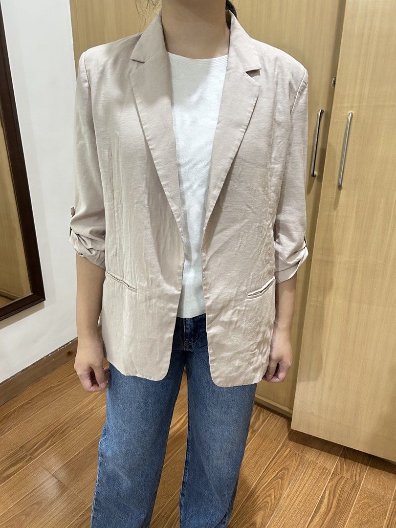 Love, Bonito Beige Linen Blend Blazer (Category: Coats, Jackets and Outerwear) located in Baguio. Submitted by tresmariascloset13 (Listing ID 1463231052, Image 3). Description: - Lightweight beige blazer from Love, Bonito - Features roll-up sleeves with button detail - Two functional front pockets - Ideal for layering over tops or dresses - Versatile for dressing up or down - Comfortable material.