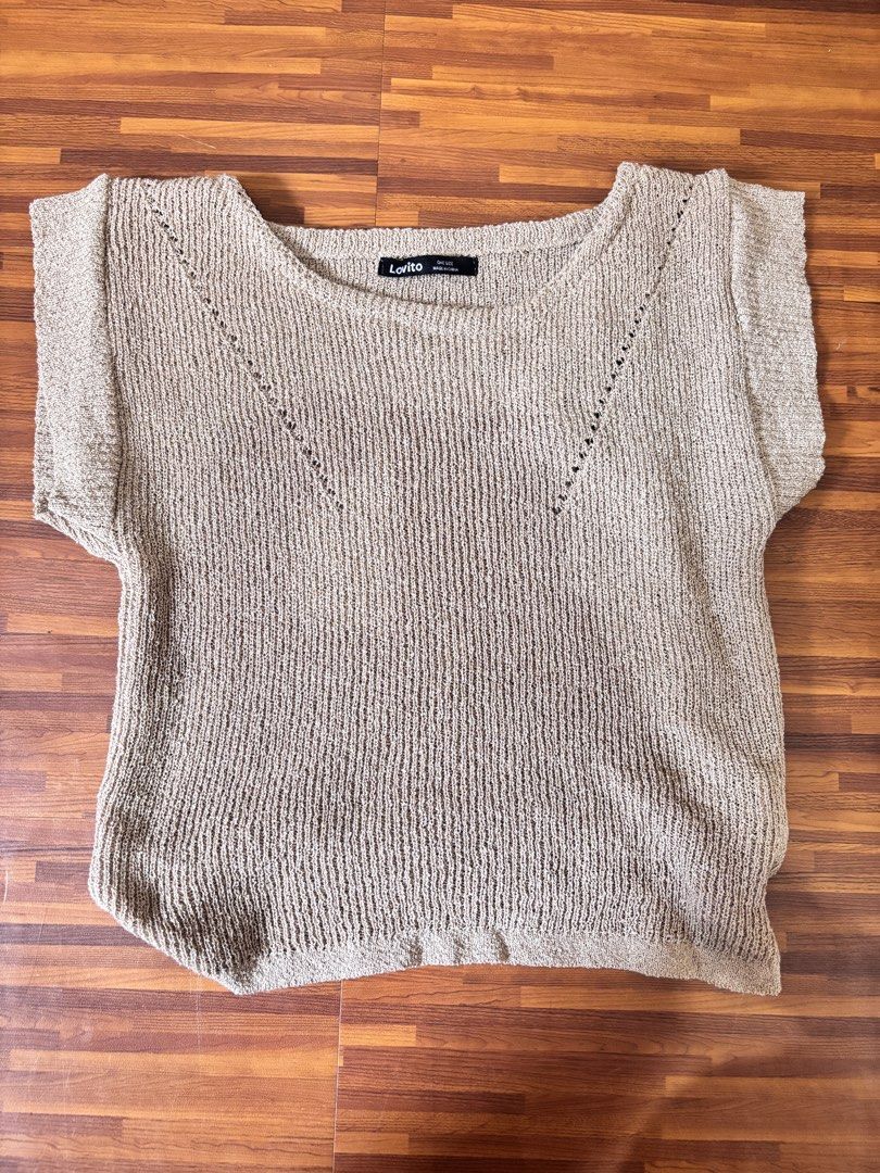 Lovito Knit Top Short Sleeves Beige (Category: Blouses) located in Marilao. Submitted by vhi3yhn (Listing ID 1463265211, Image 1). Description: - Beige knit top from Lovito - Short sleeves with textured knit - Drawstring tie at the hem - Relaxed fit - Ideal for casual wear.