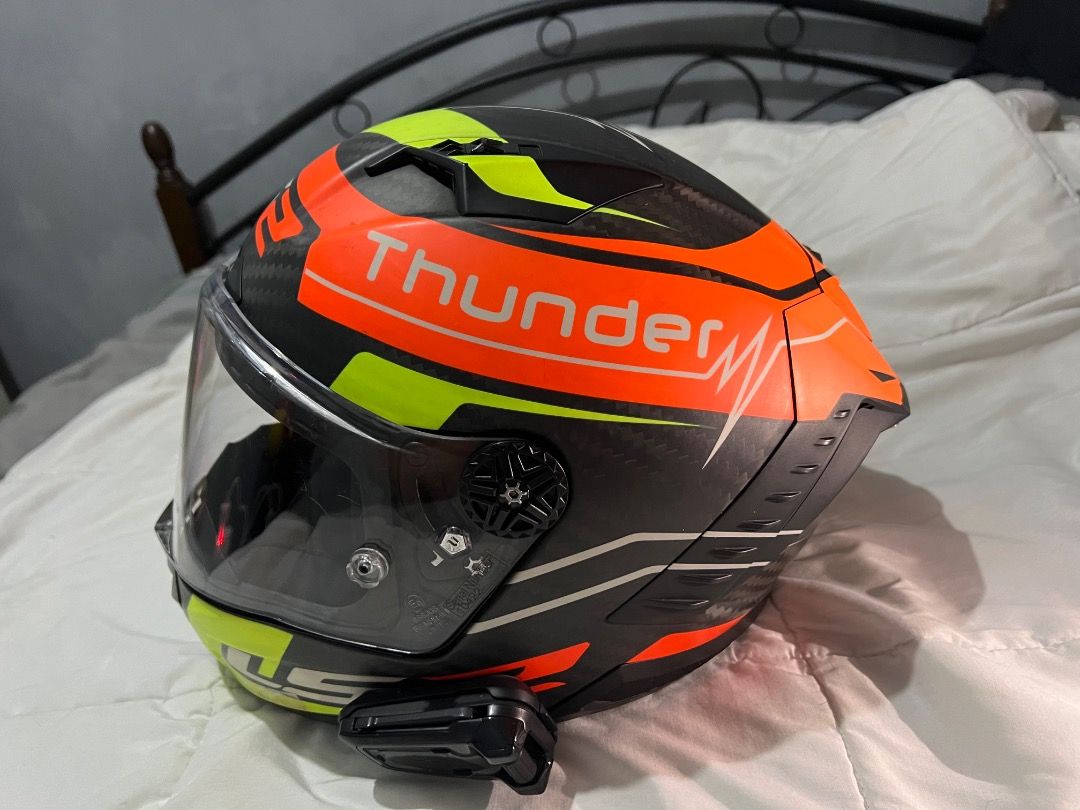 LS2 Thunder Motorcycle Helmet (Category: Helmets and other Riding Gears) located in Caloocan City. Submitted by purepenguin.097493 (Listing ID 1463213748, Image 1). Description: - LS2 Thunder Helmet - Striking design: Bright orange, neon yellow, and black - Stylish carbon fiber look - Comes with a clear visor - Integrated Bluetooth communicator - Perfect for your next motorcycle adventure!.
