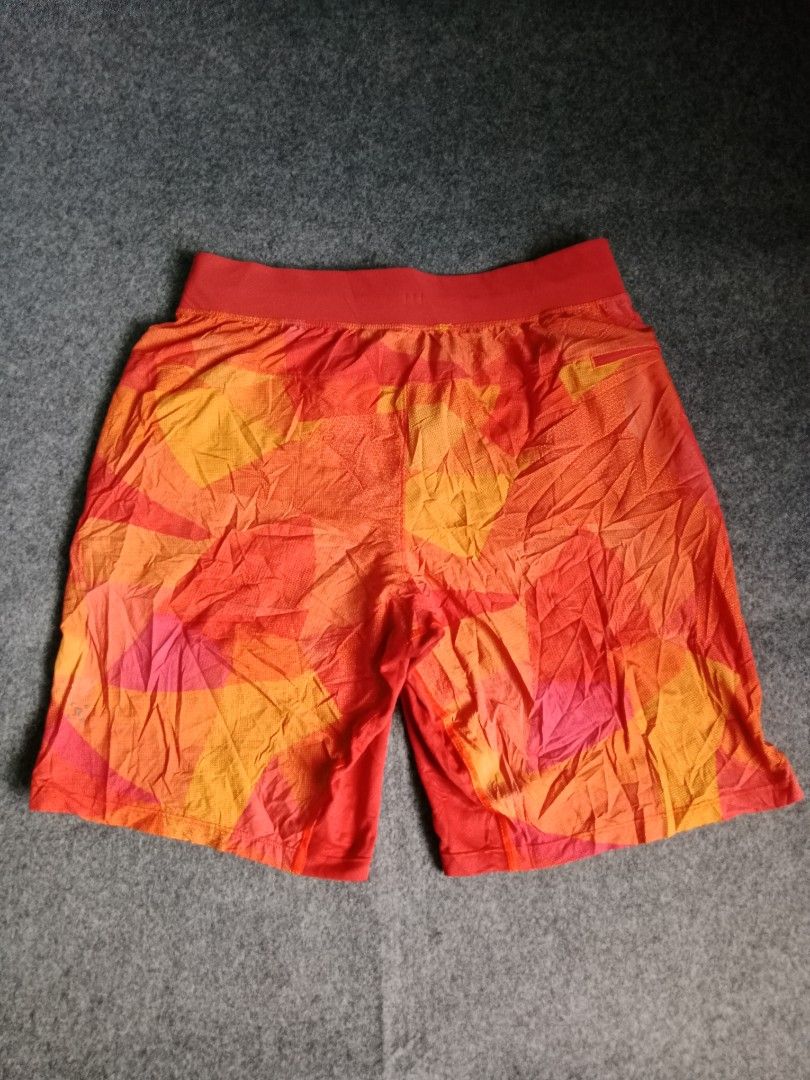 Lululemon Athletic Shorts Orange Abstract Print (Category: Activewear) located in Alburquerque. Submitted by romnickhatosa (Listing ID 1463176542, Image 2). Description: - Vibrant orange and yellow abstract print athletic shorts - Brand: Lululemon (logo on drawstring tips) - Features: Elastic waistband with adjustable drawstring - Material: Lightweight and breathable for maximum comfort - Ideal for: Running, gym workouts, and active days.