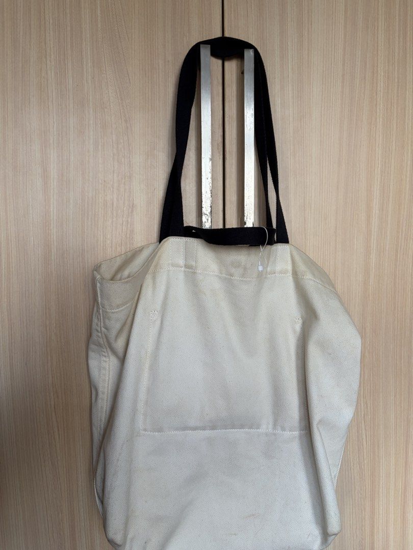 Lululemon Canvas Tote Bag (Category: Tote Bags) located in Taguig. Submitted by imgthrift (Listing ID 1463207853, Image 3). Description: - Classic Lululemon tote bag - Color: Cream canvas with black handles and logo - Size: Good for everyday use, groceries, or carrying essentials.