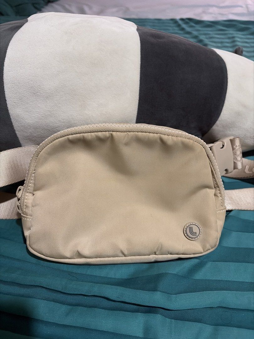 LOLE Everywhere Belt Bag - Beige (Category: Cross-body Bags) located in Las Pinas. Submitted by ces0427 (Listing ID 1463326251, Image 1). Description: - Beige Lululemon Everywhere Belt Bag - Water-repellent fabric - Multiple interior pockets for organization - Adjustable strap for a comfortable fit - Ideal for everyday use, travel, and workouts - Easy to clean and durable - Fits essentials like phone, wallet, and keys.