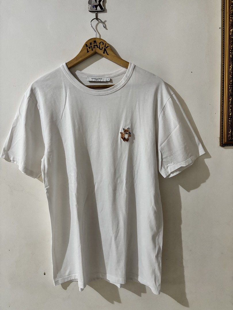 Maison Kitsuné White Tee with Fox Logo (Category: Tshirts & Polo Shirts ) located in Kalibo. Submitted by mack29 (Listing ID 1463128697, Image 1). Description: - Authentic Maison Kitsuné T-shirt - Classic white color - Features iconic embroidered fox logo on chest - Made in Portugal - 100% premium cotton - Size: Medium (M) - Ideal for casual and stylish everyday wear.