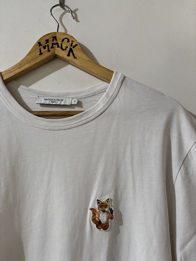 Maison Kitsuné White Tee with Fox Logo (Category: Tshirts & Polo Shirts ) located in Kalibo. Submitted by mack29 (Listing ID 1463128697, Image 3). Description: - Authentic Maison Kitsuné T-shirt - Classic white color - Features iconic embroidered fox logo on chest - Made in Portugal - 100% premium cotton - Size: Medium (M) - Ideal for casual and stylish everyday wear.