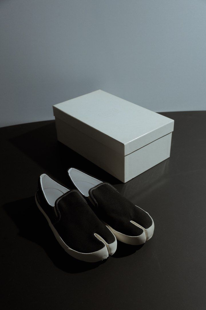 Maison Margiela Tabi Split-Toe Canvas Sneakers Black Size 42 (Category: Shoe inserts & accessories) located in Quezon City. Submitted by avellana.al (Listing ID 1463241460, Image 3). Description: - Authentic Maison Margiela Tabi split-toe sneakers - Color: Black - Material: Canvas - Style: Slip-on - Iconic Tabi split toe design - "22" and "Maison Margiela Paris" branding on heel - Size: 42 - Comes with original box.