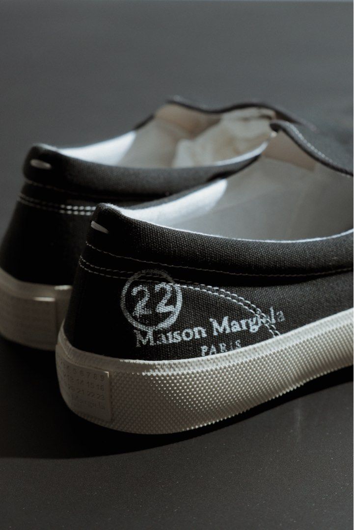 Maison Margiela Tabi Split-Toe Canvas Sneakers Black Size 42 (Category: Shoe inserts & accessories) located in Quezon City. Submitted by avellana.al (Listing ID 1463241460, Image 2). Description: - Authentic Maison Margiela Tabi split-toe sneakers - Color: Black - Material: Canvas - Style: Slip-on - Iconic Tabi split toe design - "22" and "Maison Margiela Paris" branding on heel - Size: 42 - Comes with original box.
