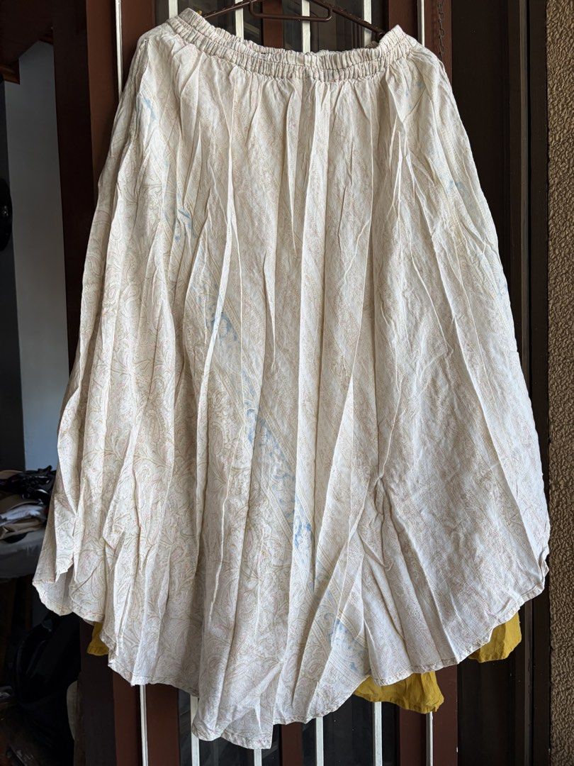 MALAKA Made in India Boho Maxi Skirt with Pockets (Category: Skirts) located in Las Pinas. Submitted by celly_belly (Listing ID 1463177686, Image 3). Description: - Flowy maxi skirt from MALAKA - Cream base with a subtle patterned print - Mustard yellow underskirt for a layered effect - Comfortable elastic waistband - Features convenient pockets - Ideal for casual outings or a beachy aesthetic.